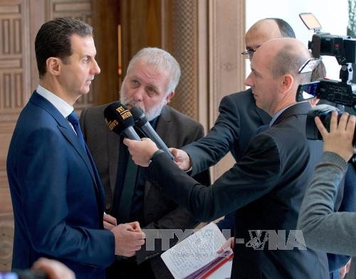 Syrian President ready for direct talks with all opposition groups - ảnh 1